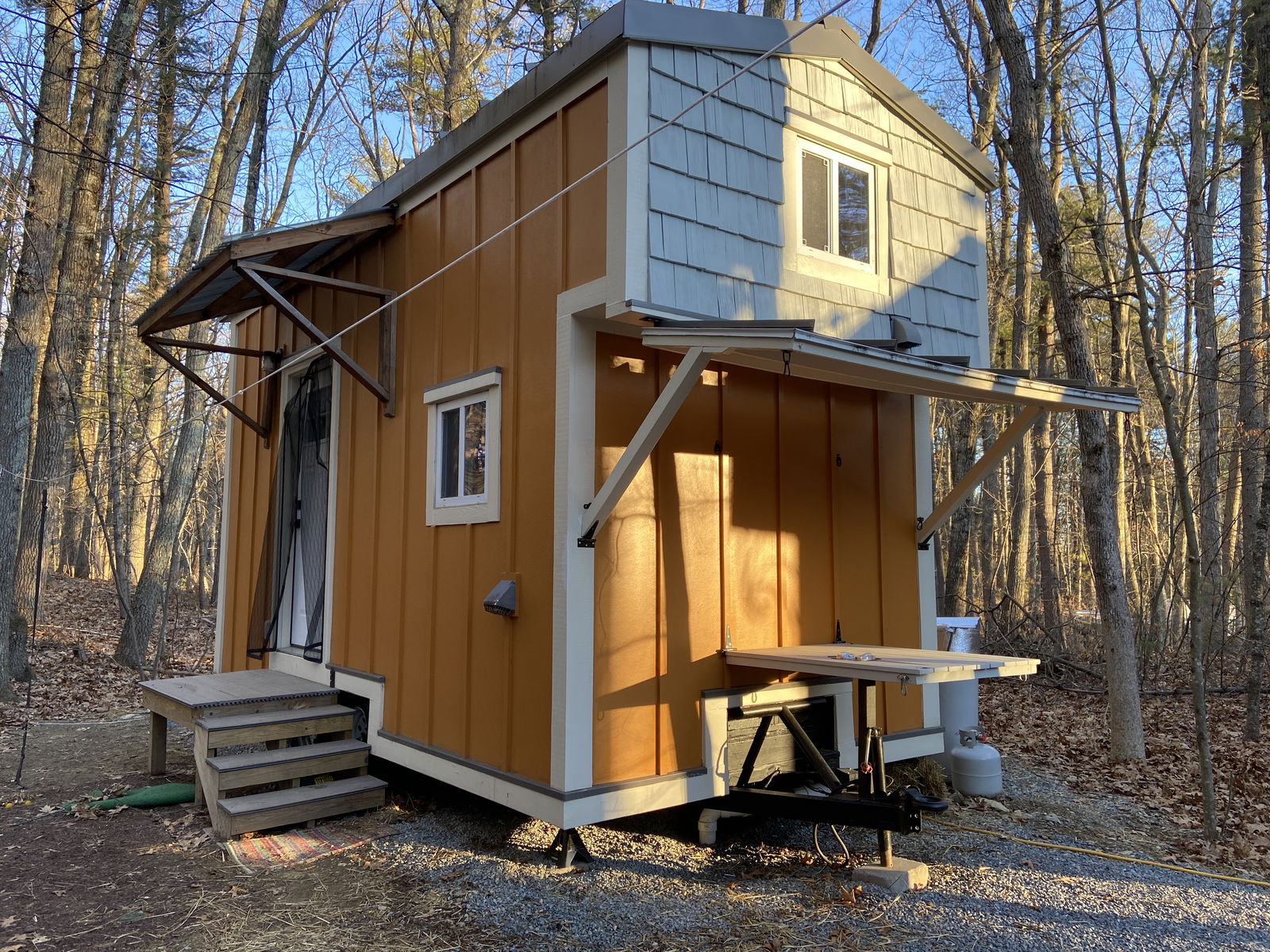For Sale: Tiny Home with Pine Interior and Cozy Fireplace!